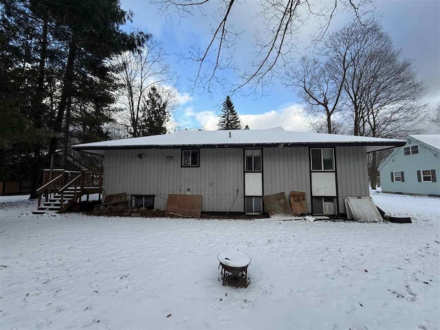 view of snow covered house