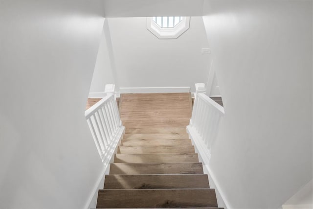 stairway with wood-type flooring