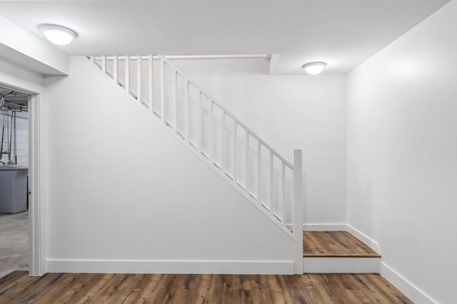 staircase featuring hardwood / wood-style flooring