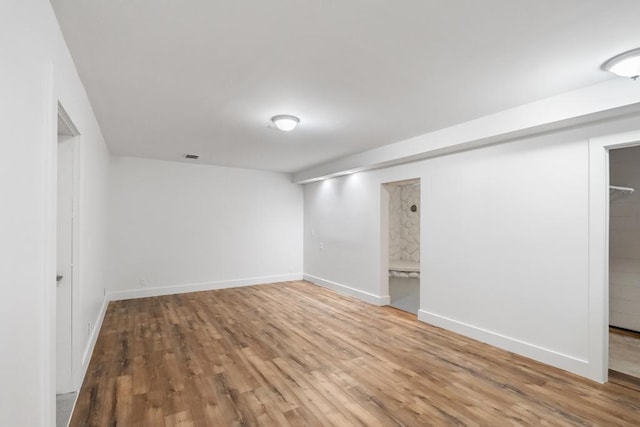 basement featuring hardwood / wood-style flooring