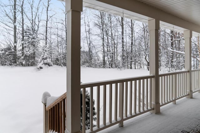 view of snow covered deck