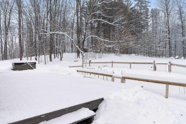 view of yard layered in snow