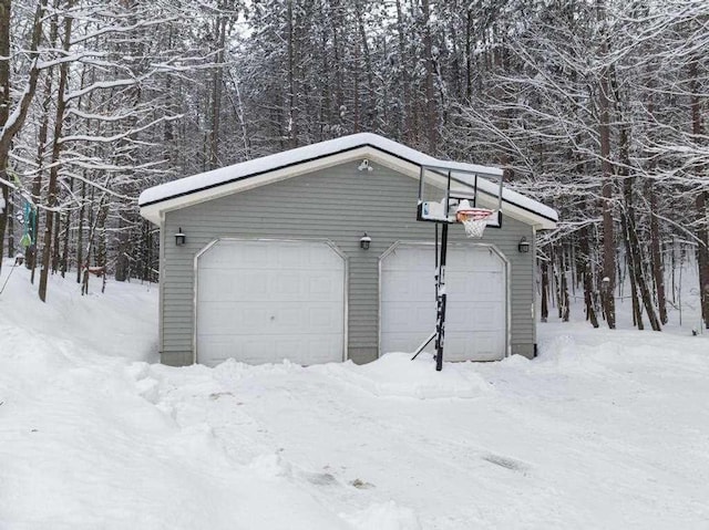 view of snow covered garage