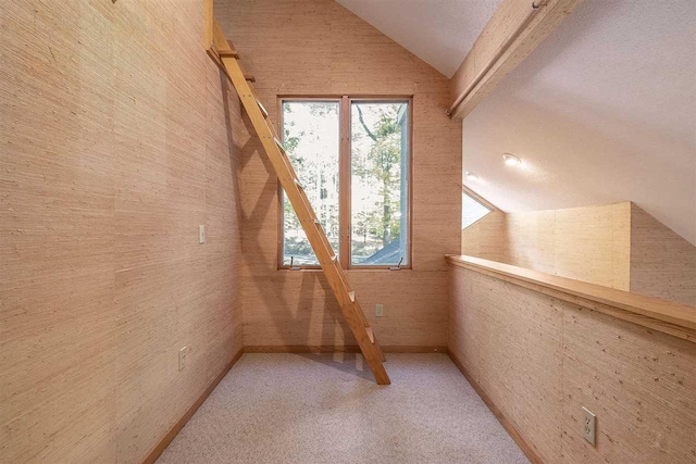 bonus room featuring vaulted ceiling with beams and carpet floors