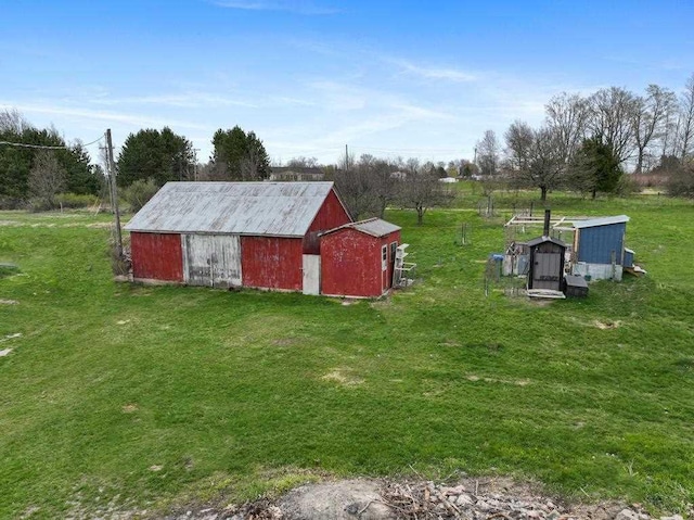 view of outbuilding with a lawn