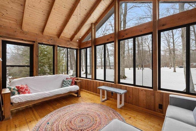 sunroom with wooden ceiling and lofted ceiling with beams