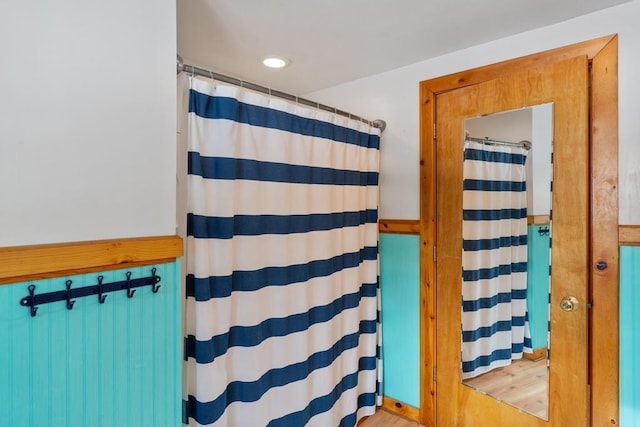 bathroom with hardwood / wood-style flooring