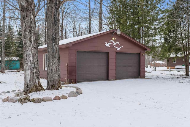 view of snow covered garage