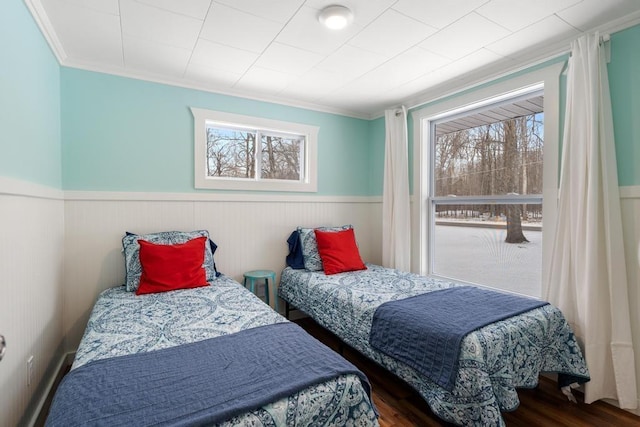 bedroom featuring dark hardwood / wood-style floors and ornamental molding