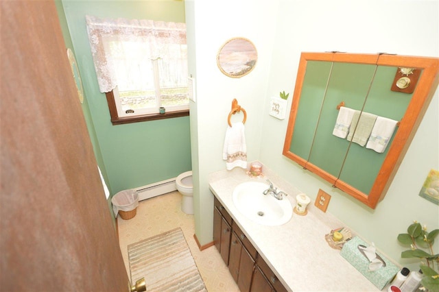 bathroom featuring toilet, tile patterned floors, vanity, and a baseboard radiator