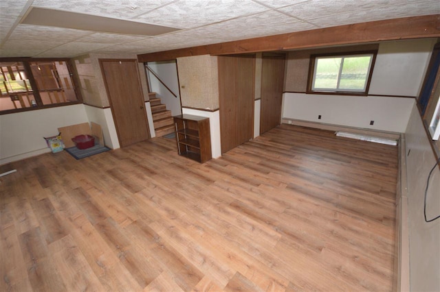 basement with hardwood / wood-style floors