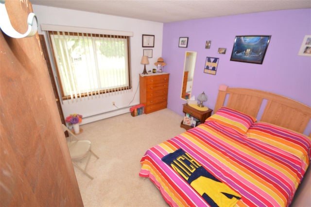 bedroom featuring carpet floors and baseboard heating