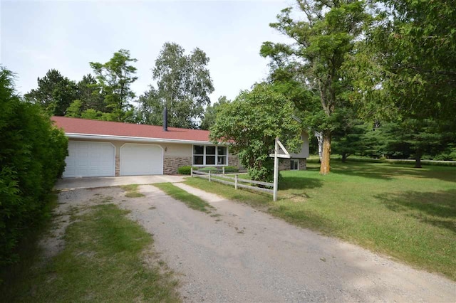 view of front facade with a front lawn and a garage