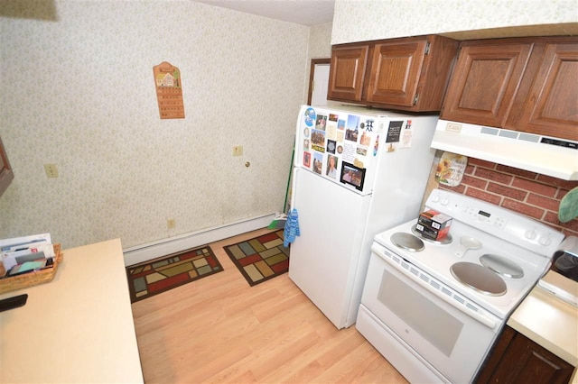 kitchen featuring light hardwood / wood-style floors, baseboard heating, and white appliances