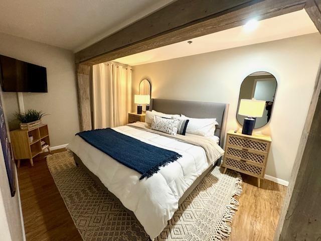 bedroom featuring wood-type flooring