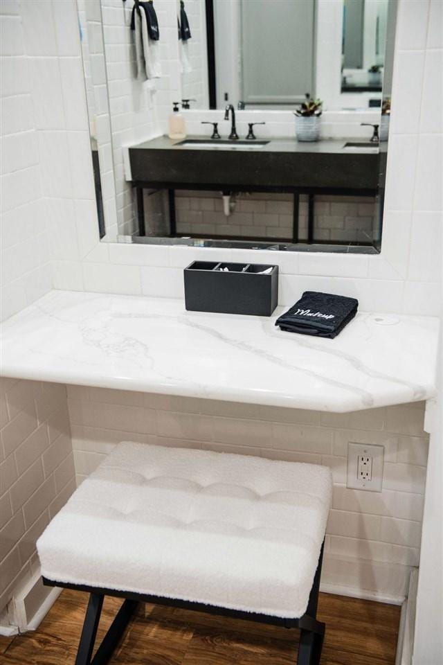 bathroom with hardwood / wood-style flooring and vanity