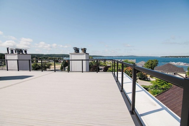 wooden deck featuring a water view