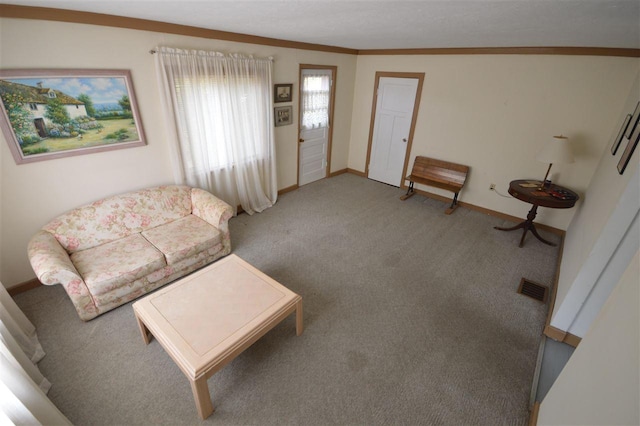 carpeted living room with ornamental molding