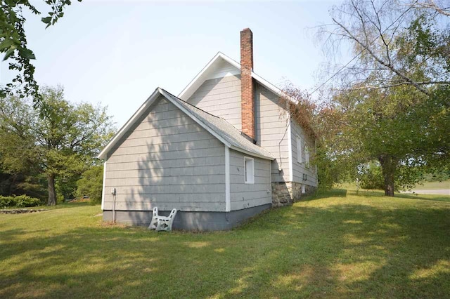 view of home's exterior featuring a yard