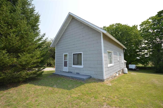 view of home's exterior featuring a yard