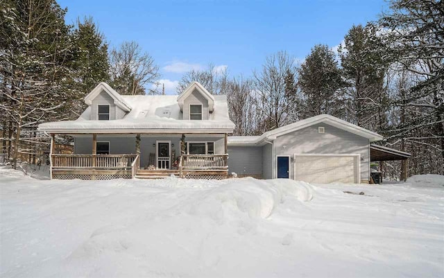 view of front of property featuring a porch, a garage, and a carport