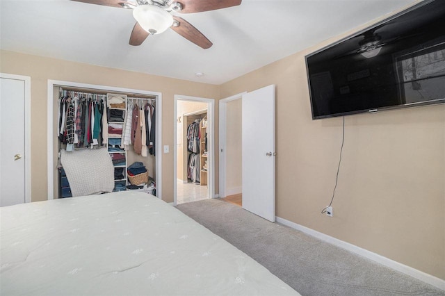 bedroom with ceiling fan and light colored carpet