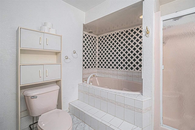 bathroom featuring toilet and separate shower and tub