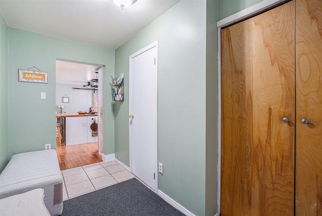 hallway with light tile patterned floors