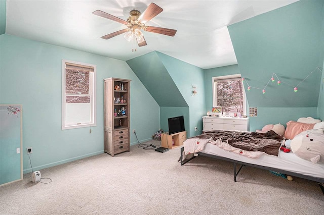 bedroom with ceiling fan, multiple windows, and carpet floors