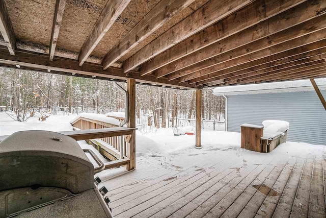 snow covered deck featuring grilling area