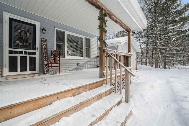 view of snow covered deck