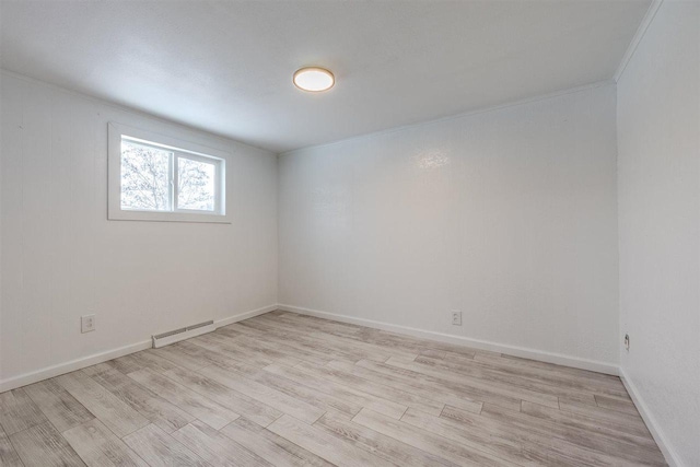 unfurnished room with light hardwood / wood-style flooring