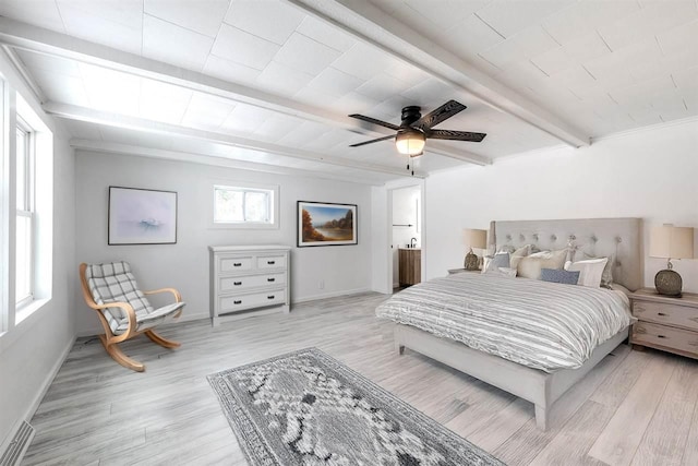 bedroom with light hardwood / wood-style floors, beamed ceiling, and ceiling fan