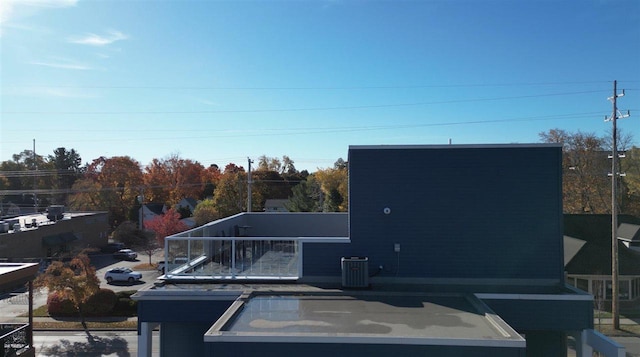 exterior space featuring a balcony and central AC unit