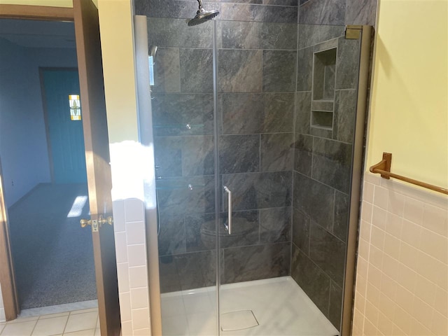 9670 Silver Strand Rd, Levering, MI 49755 - bathroom featuring a stall shower and tile patterned flooring