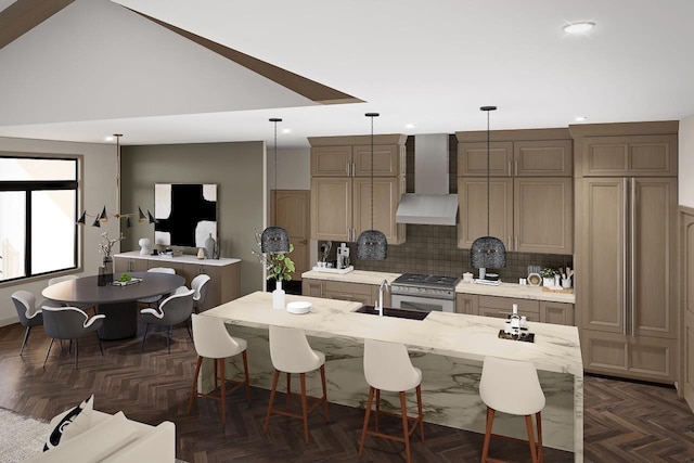 kitchen featuring decorative light fixtures, tasteful backsplash, dark parquet flooring, a center island with sink, and wall chimney exhaust hood