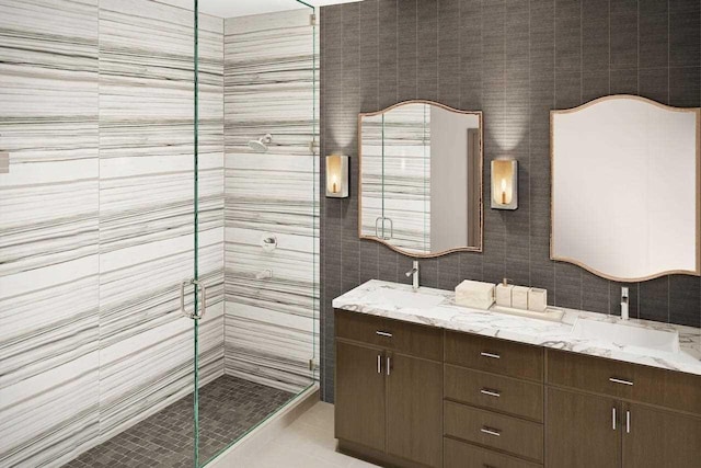 bathroom with double vanity, a stall shower, tile patterned flooring, and a sink