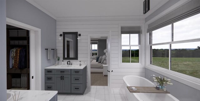 bathroom with tile patterned flooring, vanity, a tub, and wood walls