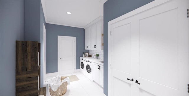 clothes washing area featuring cabinets, crown molding, independent washer and dryer, and light tile patterned flooring