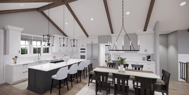 kitchen with white cabinetry, hanging light fixtures, a center island, and beamed ceiling