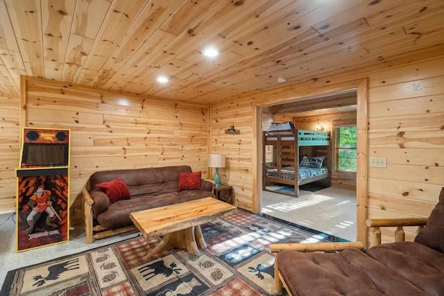 living room featuring wood ceiling, carpet floors, and wood walls