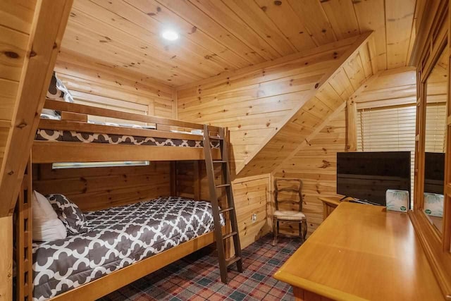 bedroom featuring wood ceiling and wood walls