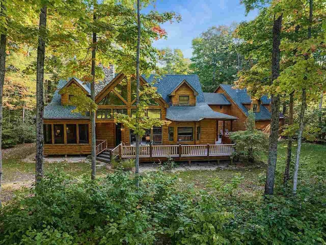 back of property featuring a sunroom