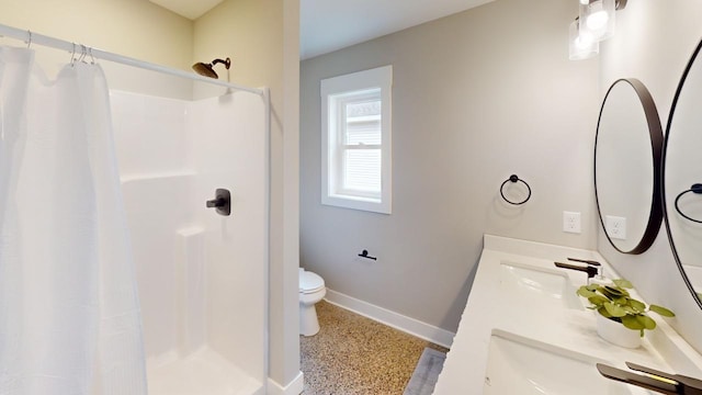 bathroom with vanity, a shower with curtain, and toilet