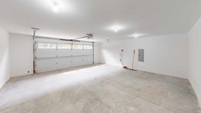 garage featuring a garage door opener and electric panel