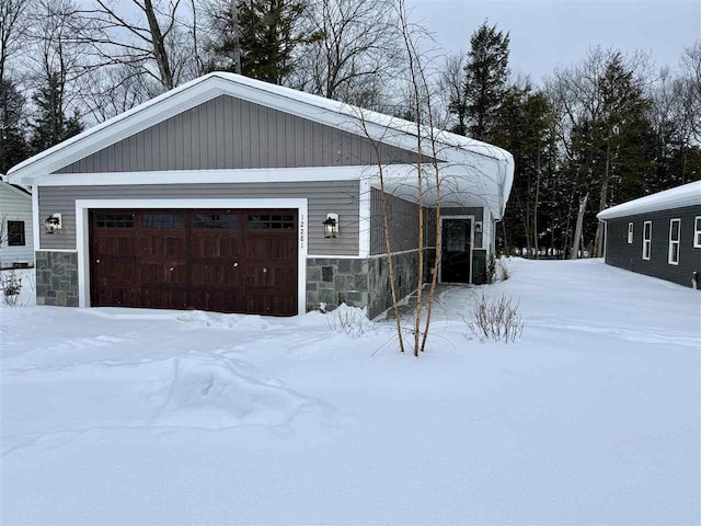 view of snow covered garage