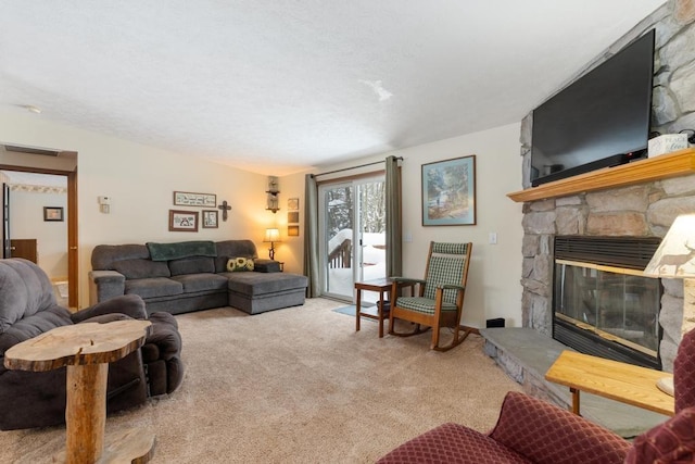 living room featuring light carpet and a fireplace