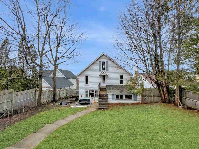 back of house with a yard