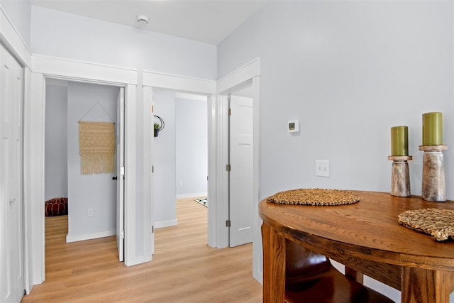 hallway with light wood-type flooring