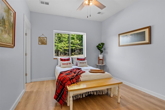 bedroom with ceiling fan and light wood-type flooring